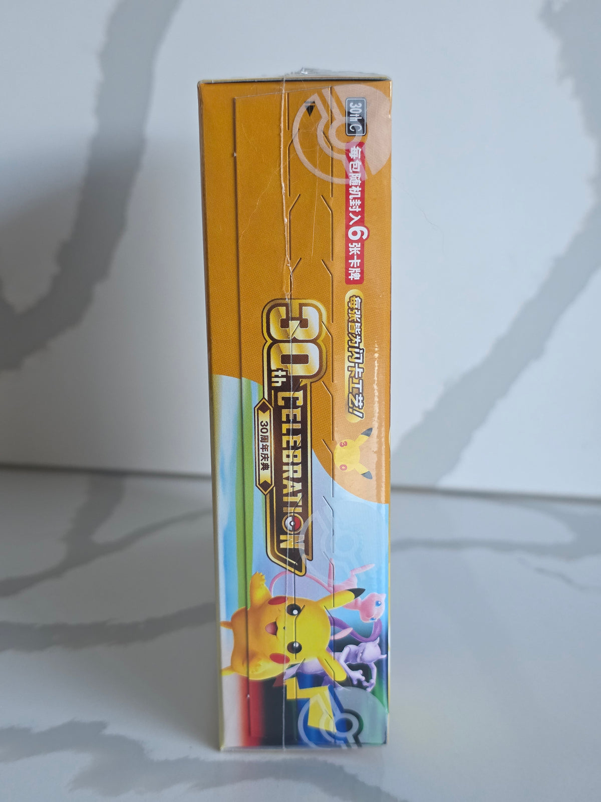 Side artwork of the sealed Pokémon 30th Celebration Chinese booster box
